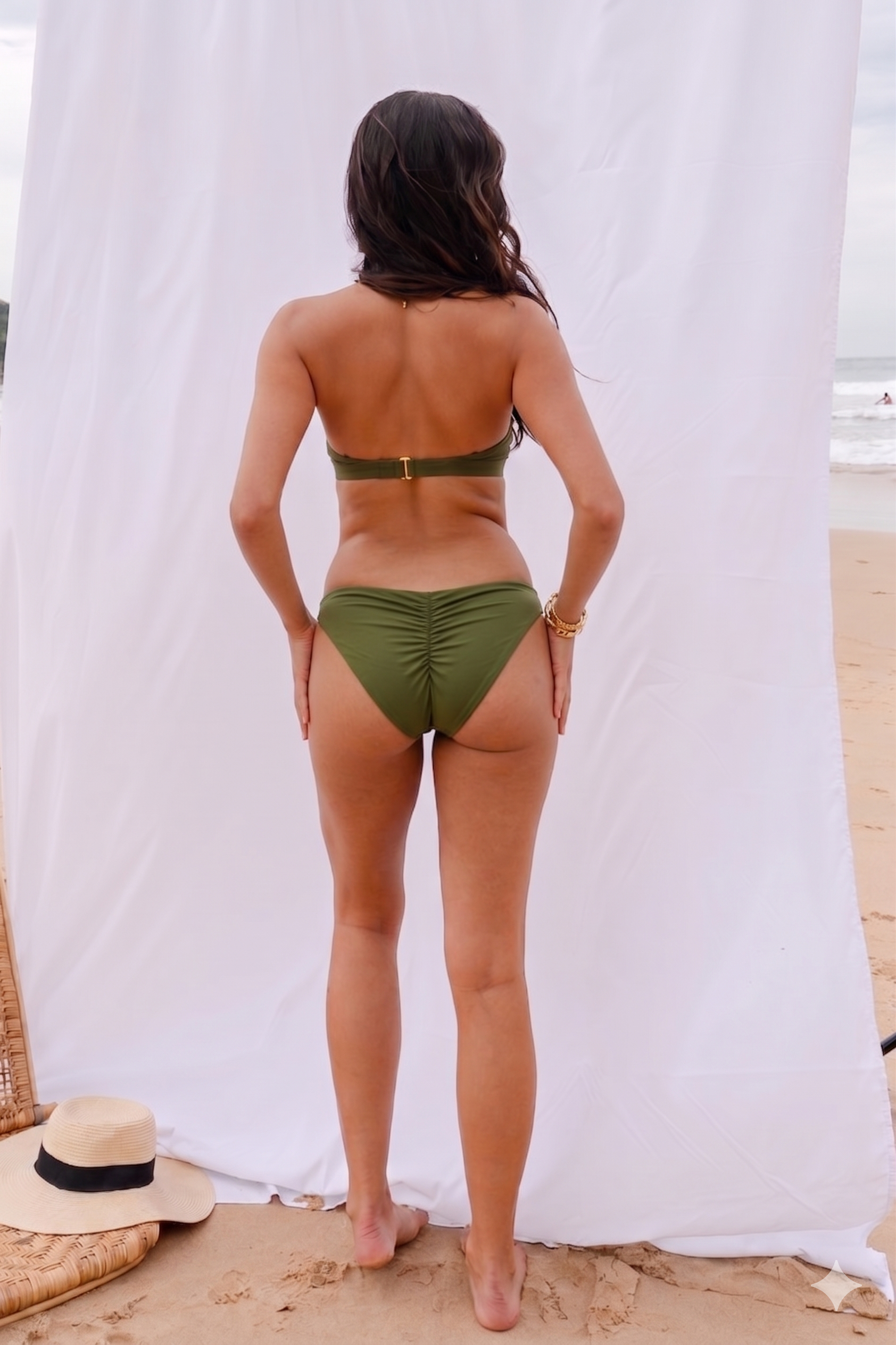 Back view of the Sofia cheeky bikini bottom showing the scrunch detail in forest green