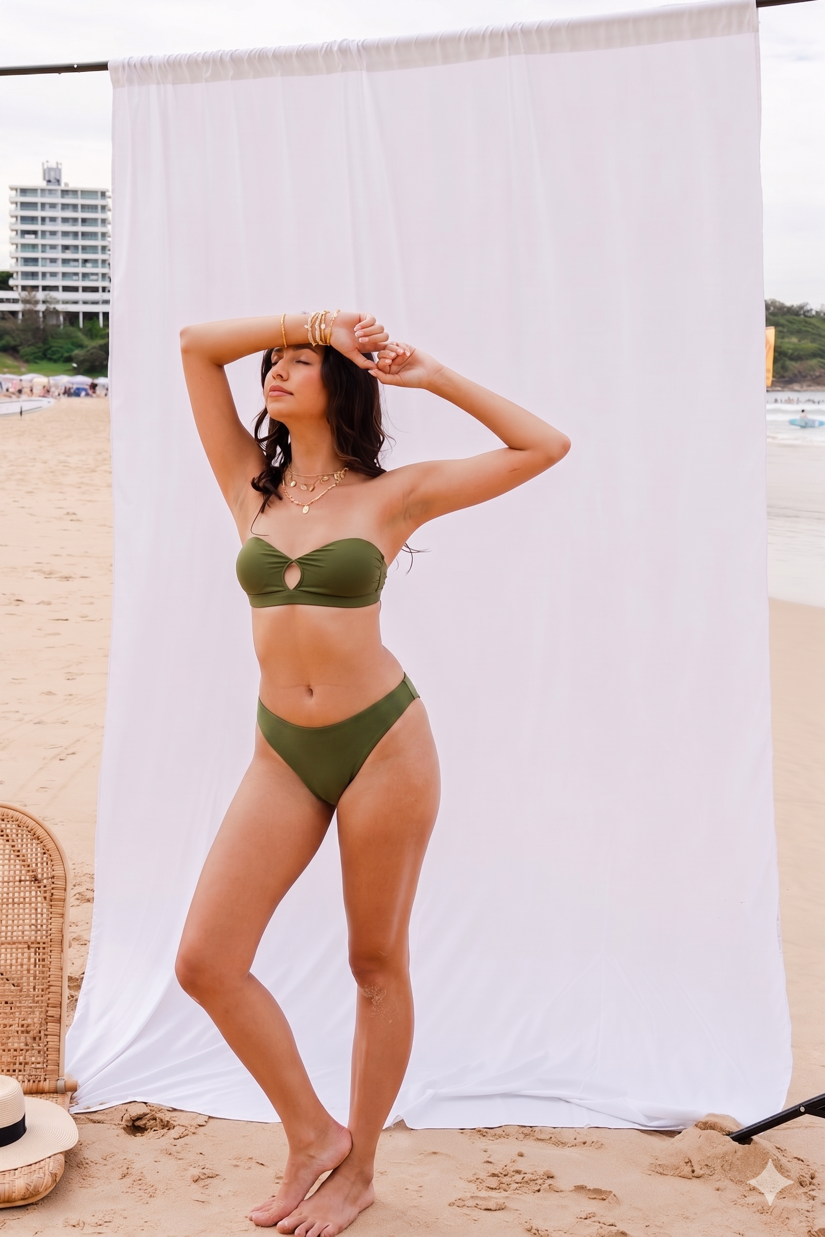 Model wearing the Sofia cheeky bikini bottom with the Mila bandeau top in forest green